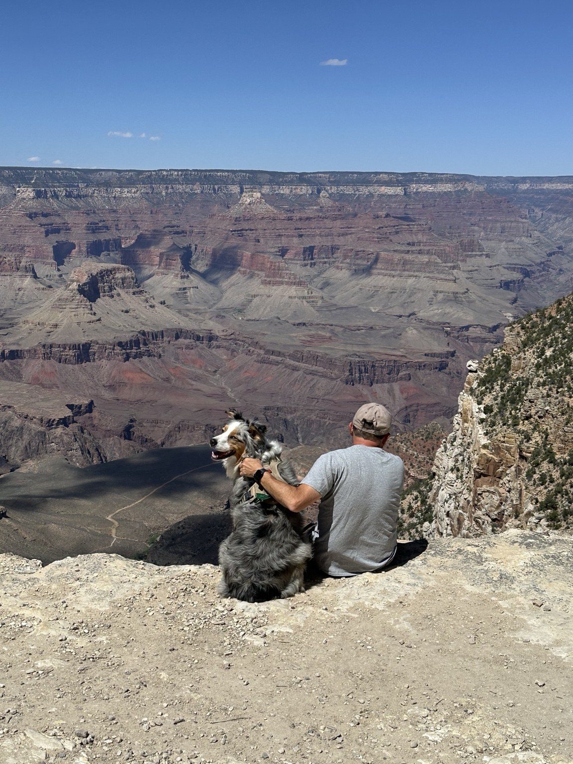 Erik and Sydney sitting together at the Grand Canyon.